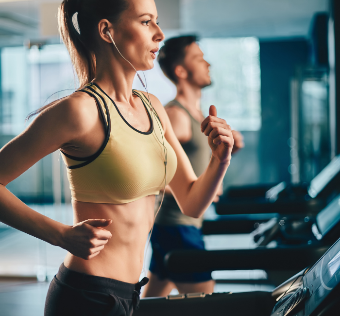 woman and man on treadmill while in virtual meeting